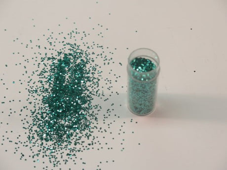 Vibrant aqua glitter in a 1kg pack for crafts, providing a long-lasting shimmer for various artistic projects.