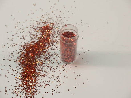 Ultra-fine 1/24" Marigold glitter in a 10gm container, perfect for crafting, scrapbooking, and home decor projects.