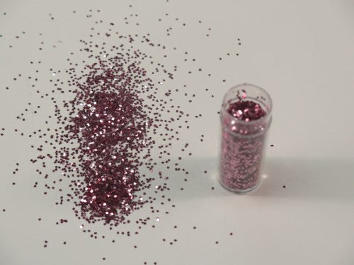 Vibrant pink 1/24" glitter in a 10gm pouch, perfect for arts, crafts, and DIY projects, non-toxic and safe for all ages.