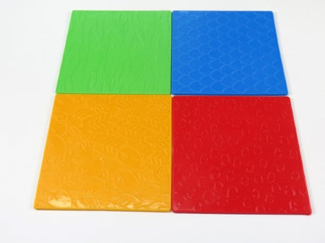 Colorful animal skin rubbing and embossing plates for kids; ideal for creative art projects and sensory exploration.