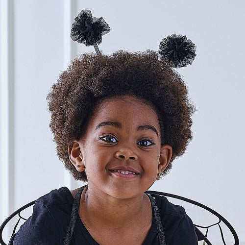 Adorable black pom-pom bumblebee headband perfect for costumes and parties, suitable for all ages.