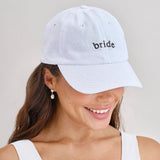 Stylish white cap with "bride" embroidered in black, perfect for hen parties and bachelorette celebrations.