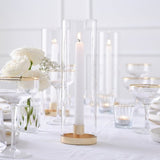 Elegant champagne gold hurricane candle holder with a glass design, perfect for creating a warm ambiance in any decor.