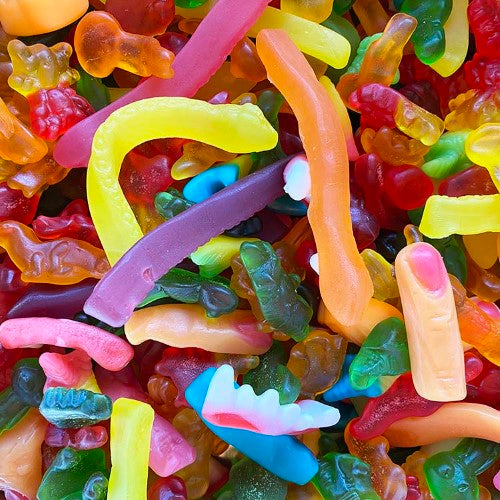 Colorful assortment of spooky gummy candies in various creepy shapes, perfect for Halloween treats and celebrations.