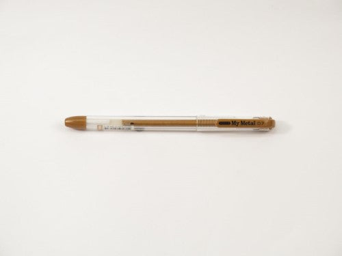 My Met A/Free Pen 0.7mm Bronze, a stylish writing pen with smooth gel ink, perfect for vibrant details on dark paper.