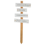 "Rustic wooden wedding signpost set with dark grey text, featuring directional signs and interchangeable arrows for ceremony decor."