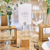 Rustic wooden block card holders with metal holders, ideal for displaying table numbers and photos at events. Pack of 4.