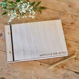 Rustic Romance Wooden Guest Book with 'Happily Ever After' design, measuring 18cm x 26cm, featuring 32 lined pages for memories.