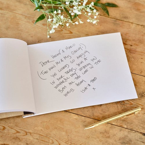 Elegant wooden guest book featuring "Happily Ever After" design with 32 lined pages for wedding memories and guest messages.