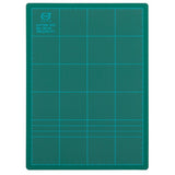 Durable 300x220 green cutting mat with self-healing surface, gridded for precise crafting and lightweight for portability.