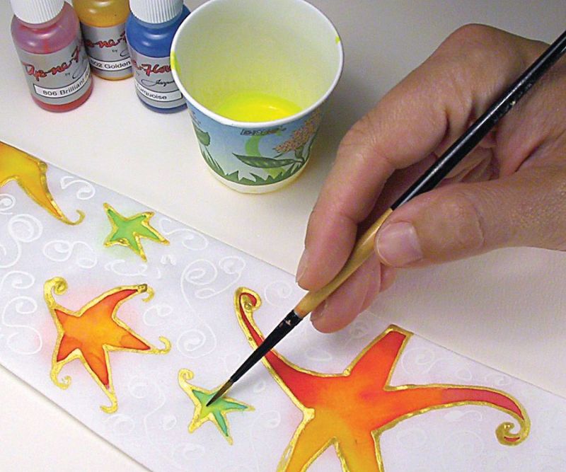 Transparent ochre fabric paint by Jacquard, ideal for various artistic techniques on multiple surfaces.