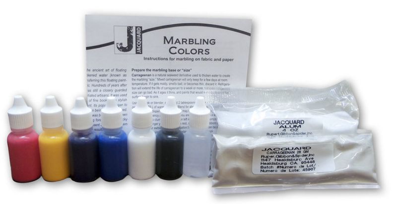 Colorful marbling kit with paints, tools, and instructions to create unique designs on paper or fabric. Perfect for artists.