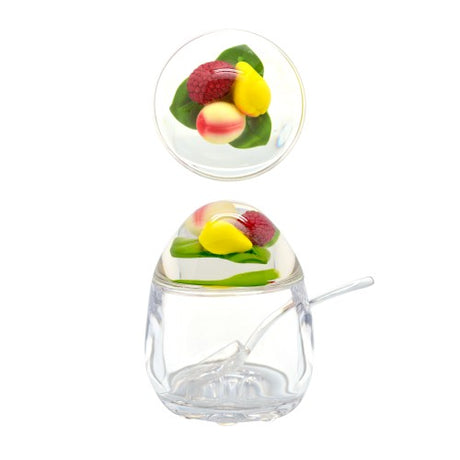Colorful acrylic jam pot with mixed fruits lid, perfect for storing and showcasing homemade jams and spreads.