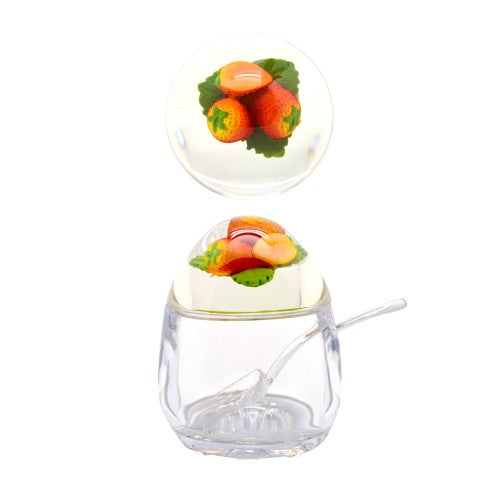 Acrylic jam pot with a whimsical strawberry lid, perfect for storing jams and jellies stylishly and securely.