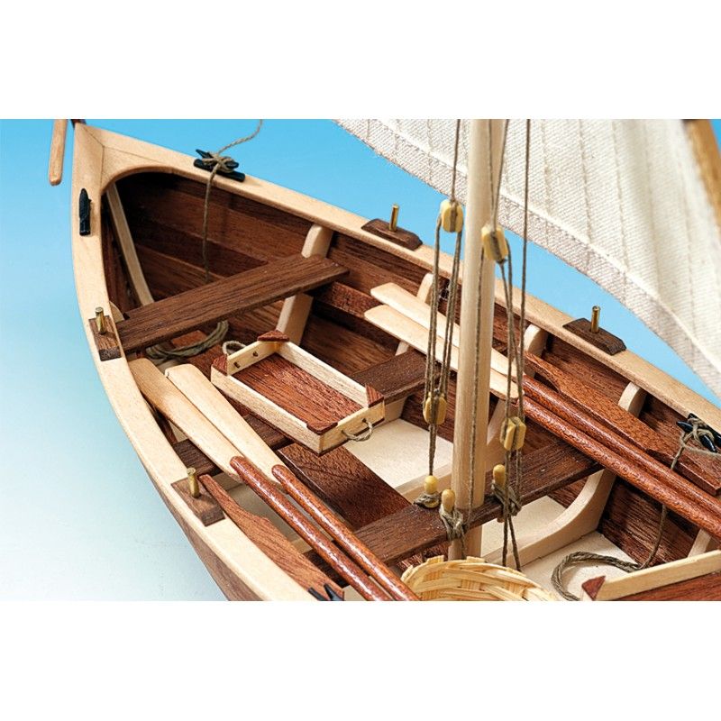 Wooden ship model kit of La Provencale featuring precision laser-cut woods, brass fittings, and hand-sewn sails, ideal for enthusiasts.