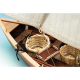 Detailed wooden ship model kit featuring laser-cut noble woods, brass fittings, and hand-sewn sails, ideal for all skill levels.