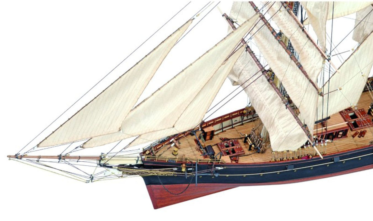 Detailed wooden ship model kit of the Cutty Sark, featuring laser-cut hardwood parts, brass, and authentic fabric elements.