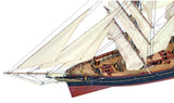 Detailed wooden ship model kit of the Cutty Sark, featuring laser-cut hardwood parts, brass, and authentic fabric elements.