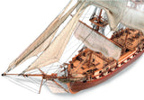 Detailed 1:85 scale model kit of USS Constellation frigate, featuring laser-cut wood, brass fittings, and cotton sails.