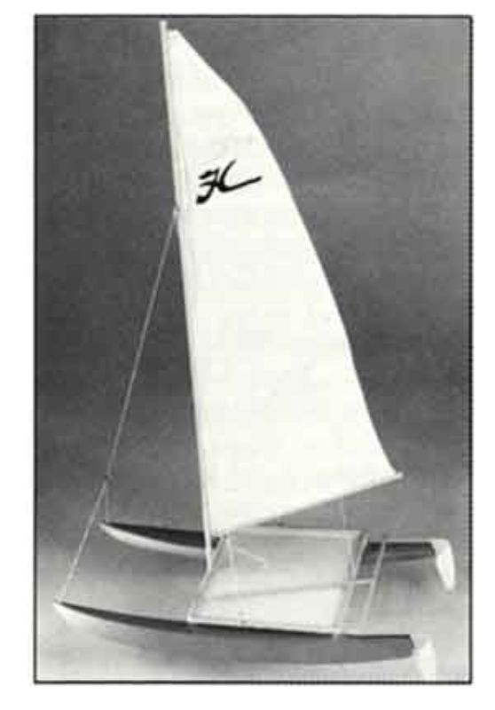 Alt text: "14-inch wooden Hobie Cat sailboat model kit with nylon sails, ideal for display and hands-on play, perfect for enthusiasts."