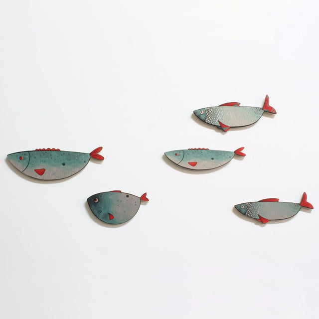 Set of five silver-accented fish wall art pieces, perfect for coastal-themed decor, suitable for indoor and covered outdoor use.