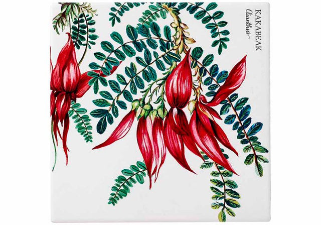 Elegant trivet set featuring Kakabeak flower design, protecting countertops while adding nature-inspired decor.