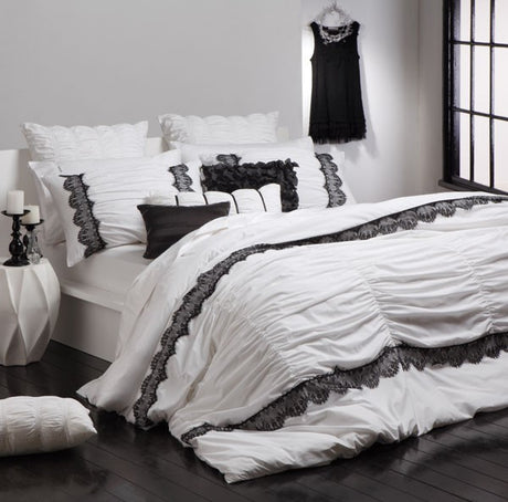 Lara White Long Cushion by Logan and Mason: elegant, plush decorative cushion perfect for enhancing any space's style and comfort.