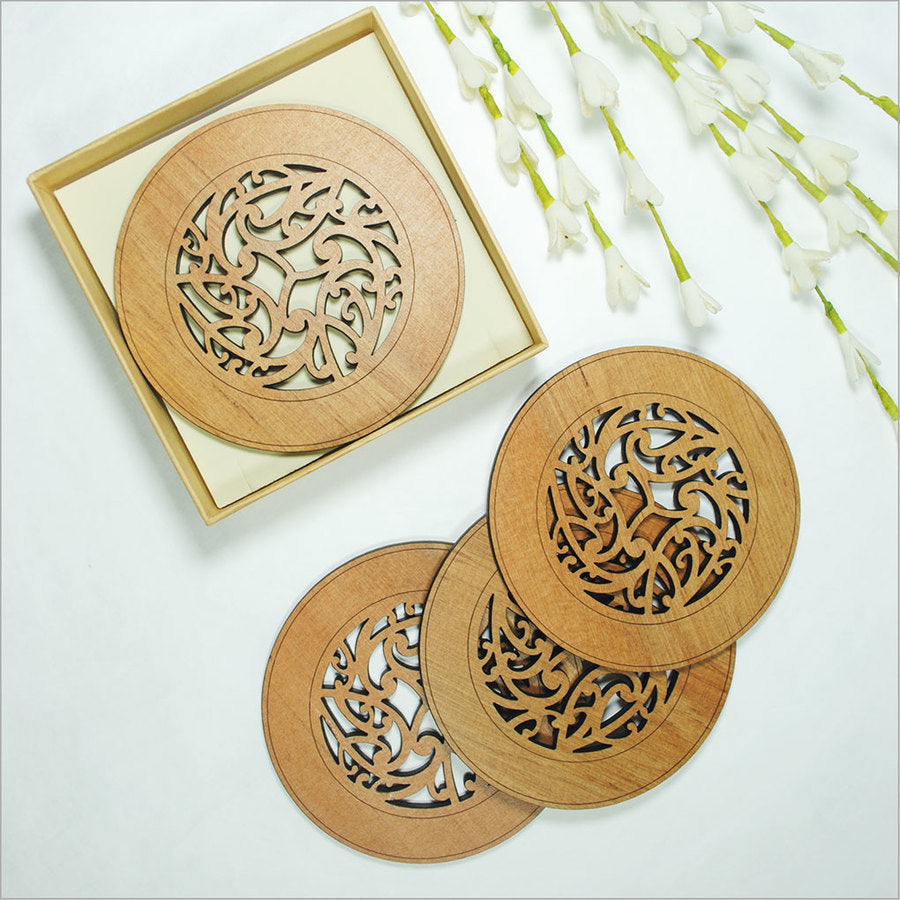 Kowhaiwhai Circle coasters, laser-cut Rimu veneer with intricate Maori designs, 100mm diameter, perfect for protecting surfaces.