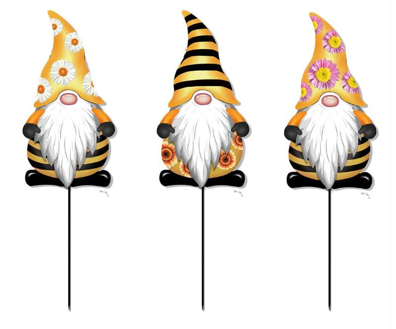 Set of 12 metal garden gnomes, 30cm tall, featuring colorful striped designs for charming outdoor decor.