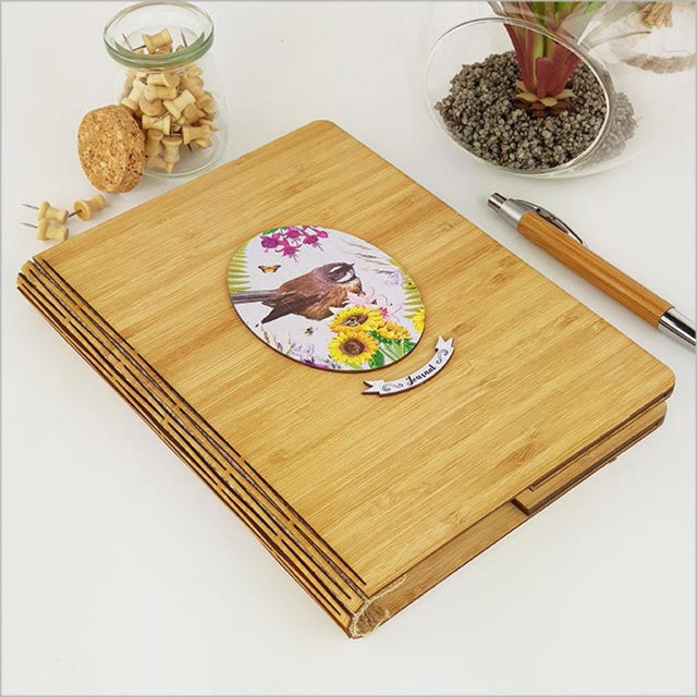 Bamboo journal with floral laser-cut design, 120 pages of high-quality paper, perfect for writing and sketching.