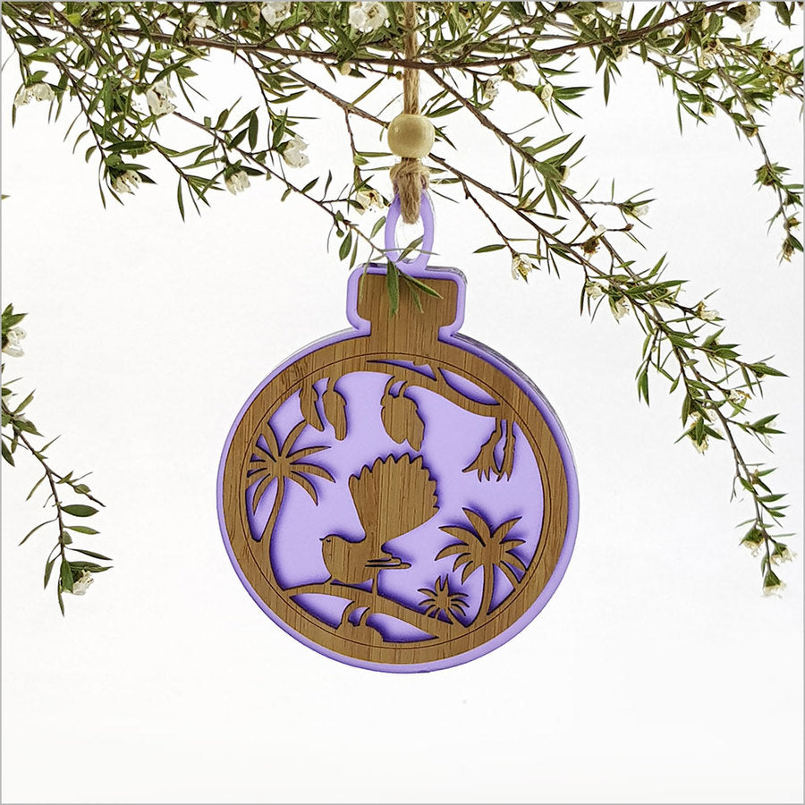 Purple satin acrylic hanging ornament featuring a fantail on a kowhai branch, beautifully laser-cut and lightweight.