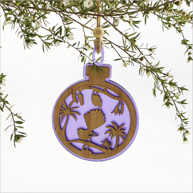 Purple satin acrylic hanging ornament featuring a fantail on a kowhai branch, beautifully laser-cut and lightweight.