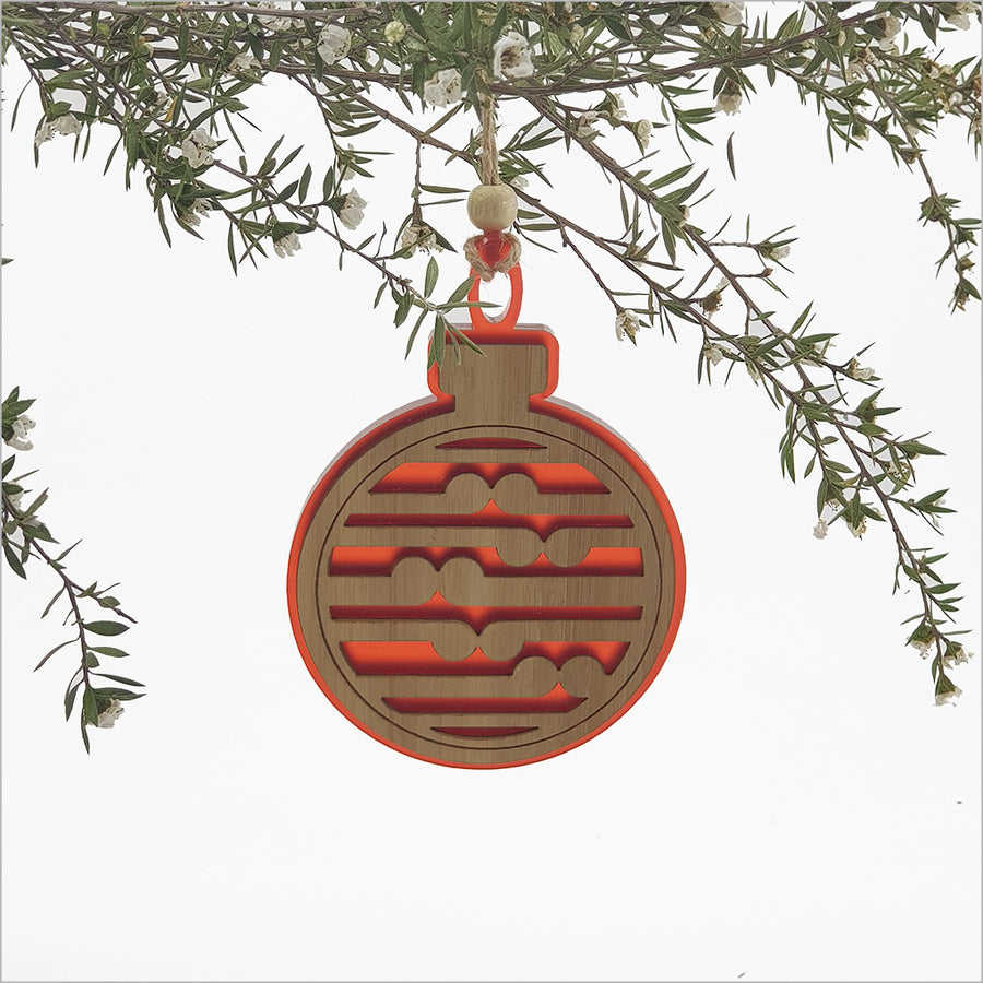 Elegant red acrylic Koru ornament, 80mm x 110mm, symbolizing new beginnings, perfect for holiday decor and gifting.