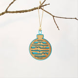 Teal satin acrylic bauble ornament with Koru design, perfect festive decor or unique gift idea, ready to hang.