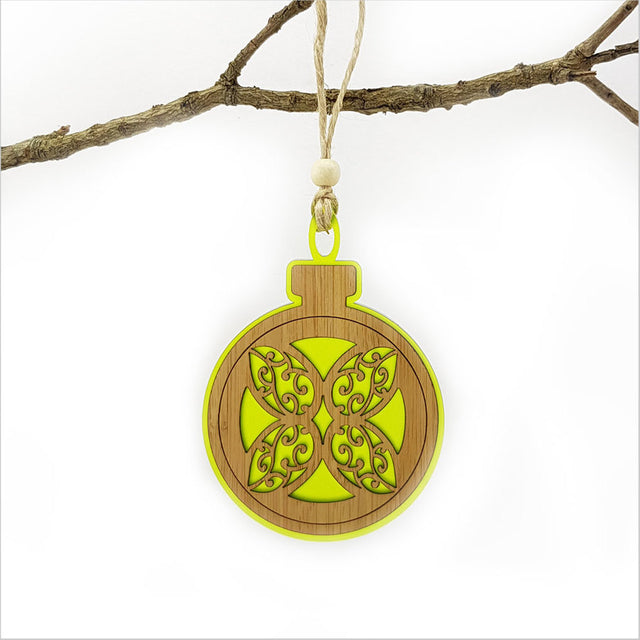 Lime green acrylic bauble ornament featuring a laser-cut flower design, perfect for modern home decor or gifting.