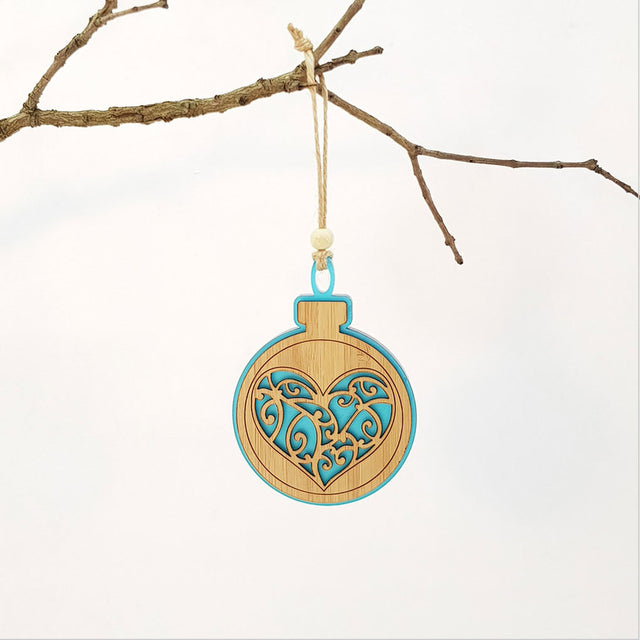 Teal satin acrylic heart-shaped hanging ornament with bamboo detail, perfect for festive decor or thoughtful gifts.