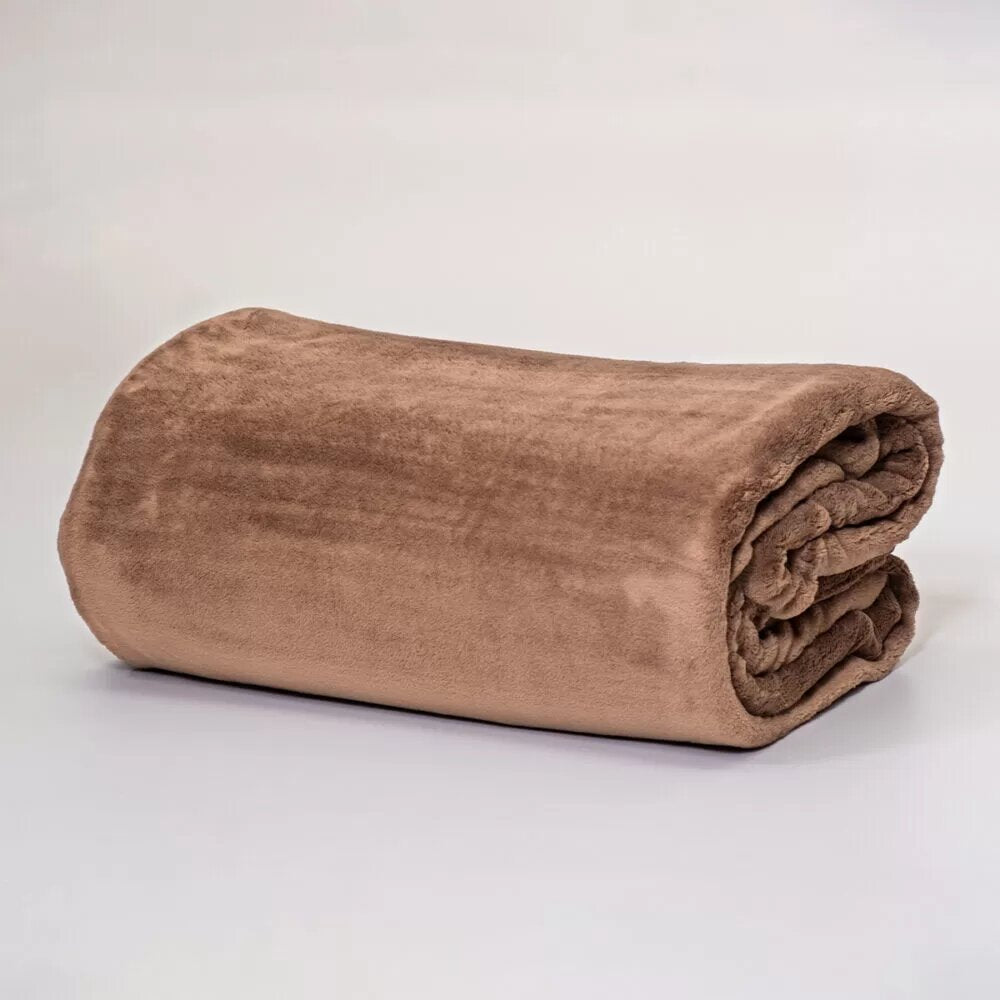 Soft coral hazelnut fleece blanket, anti-pill and hypoallergenic, perfect for cozy evenings and elegant bedroom decor.