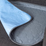 Charcoal chair pad measuring 60cm x 54cm, featuring four absorbent and waterproof layers for comfort and protection.