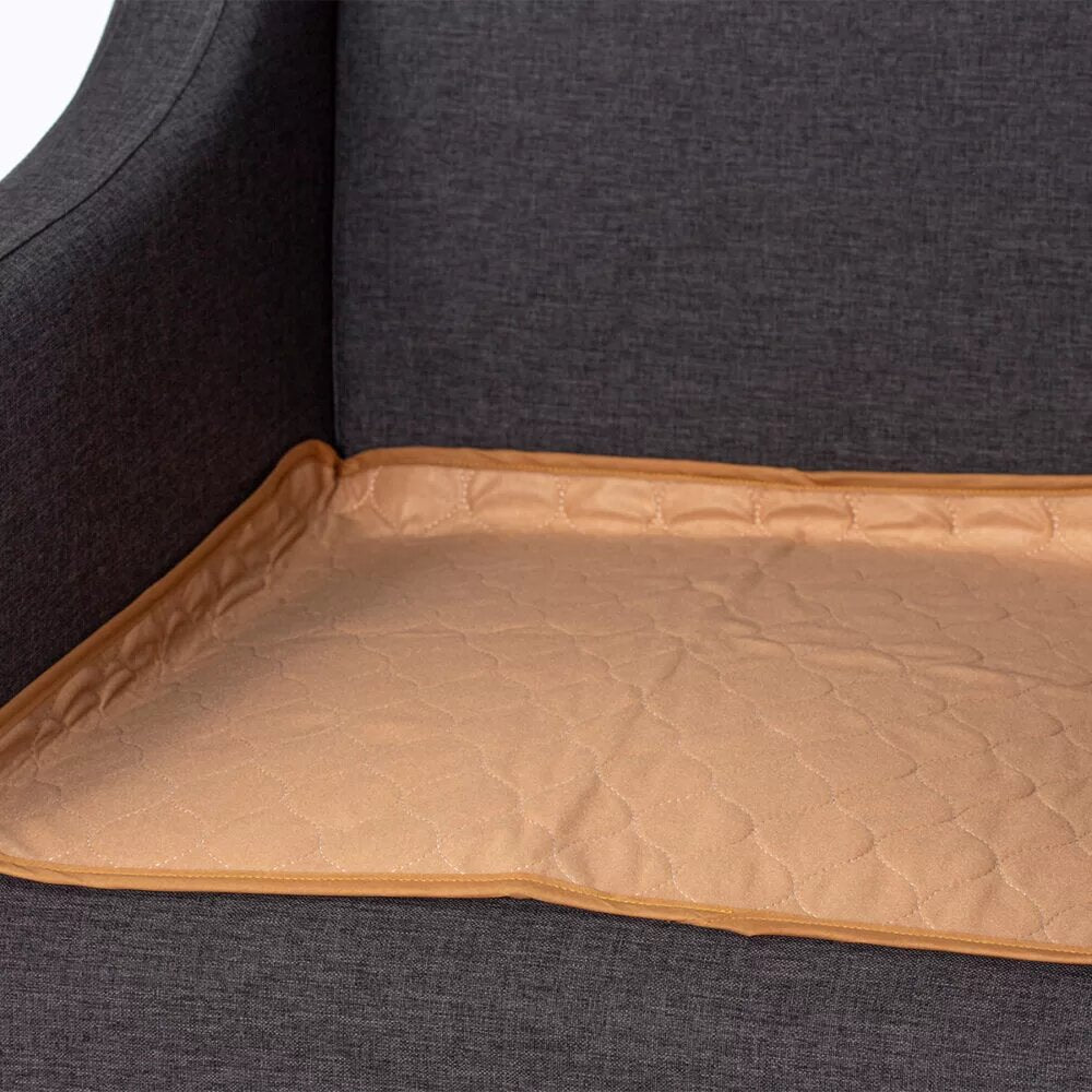 Tan Dreamticket absorbent chair pad, 60cm, with four-layer design for comfort, waterproofing, and easy maintenance.