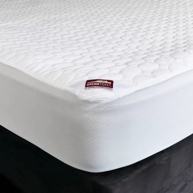 Waterproof mattress protector made from recycled materials, featuring a quilted top and snug elastic skirt for baby cots.