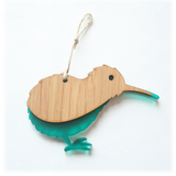 Hanging ornament featuring a kiwi design in eco-friendly bamboo and vibrant teal acrylic, perfect for home decor.