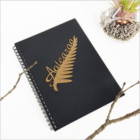 A5 journal featuring a black fern design, ideal for writing, sketching, and creative expression with 120 acid-free pages.