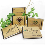 Hardbound guest book with laser-cut bamboo cover and NZ Paua accents, ideal for journaling and capturing memories.