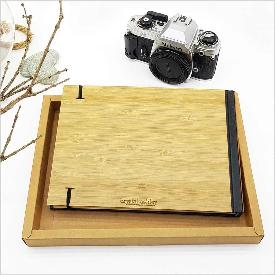 Eternity Guest Book/Journal features laser-cut bamboo and paua, perfect for capturing memories in a stylish hardbound design.