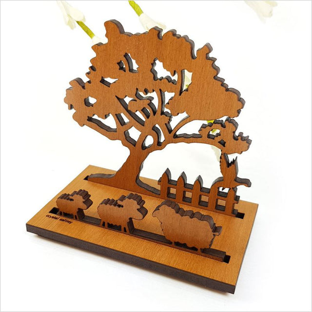 Elegant card holder featuring Pohutukawa Tree design, crafted from NZ veneer, measuring 9cm in height for functional desk decor.