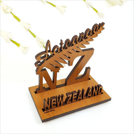 Elegant silver fern card holder, 9cm, crafted from NZ veneer, showcasing New Zealand's iconic fern design.