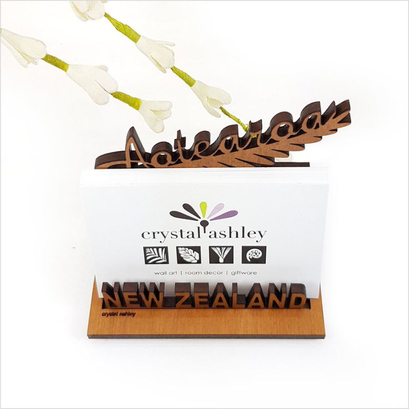 Elegant silver fern card holder showcasing iconic design, made from high-quality NZ veneer, perfect for organizing cards.