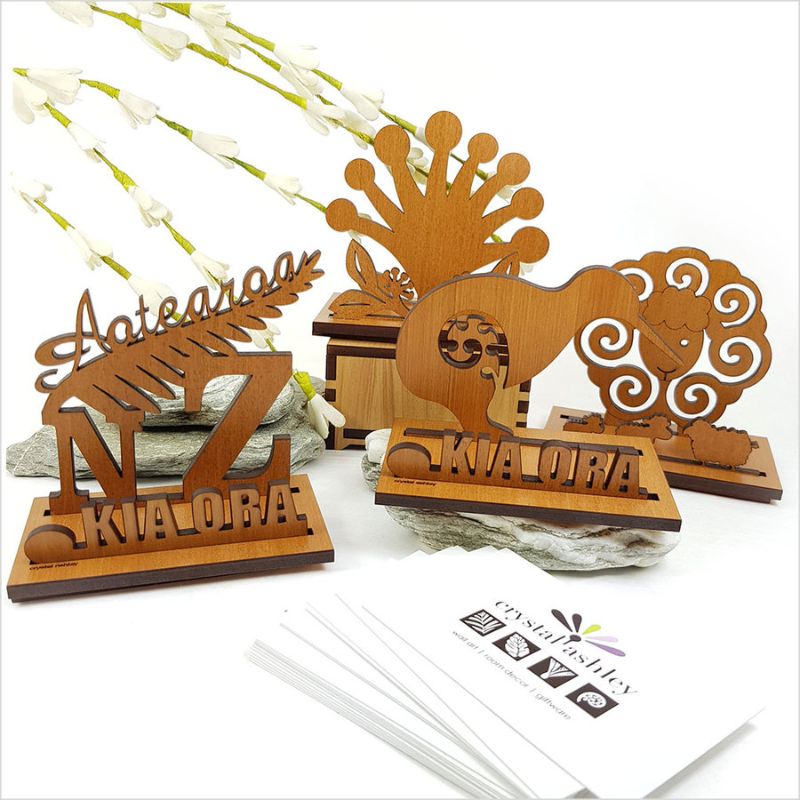 Elegant silver fern card holder made of NZ veneer, showcasing a laser-cut design and perfect for organizing cards.