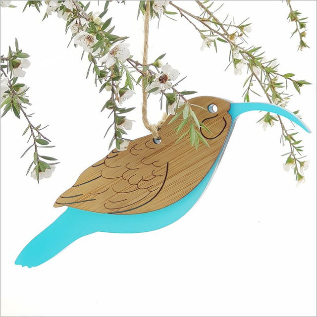 Hanging ornament featuring eco-friendly bamboo and teal ice acrylic, perfect for stylish and sustainable decor.