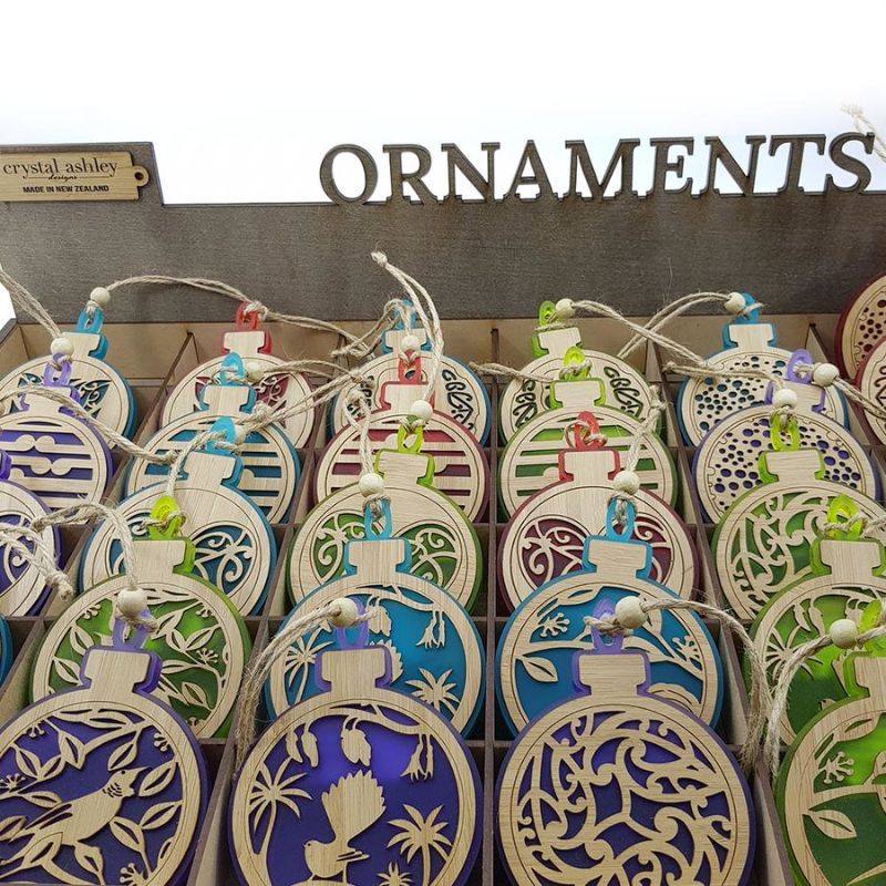 Purple satin acrylic hanging ornament featuring a fantail on a kowhai branch, ideal for festive decor or gifting.